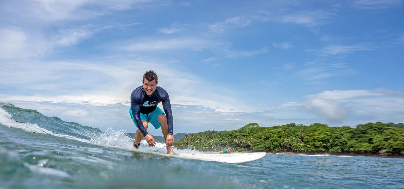 Man Surfing on his Costa Rica Surf Vacation