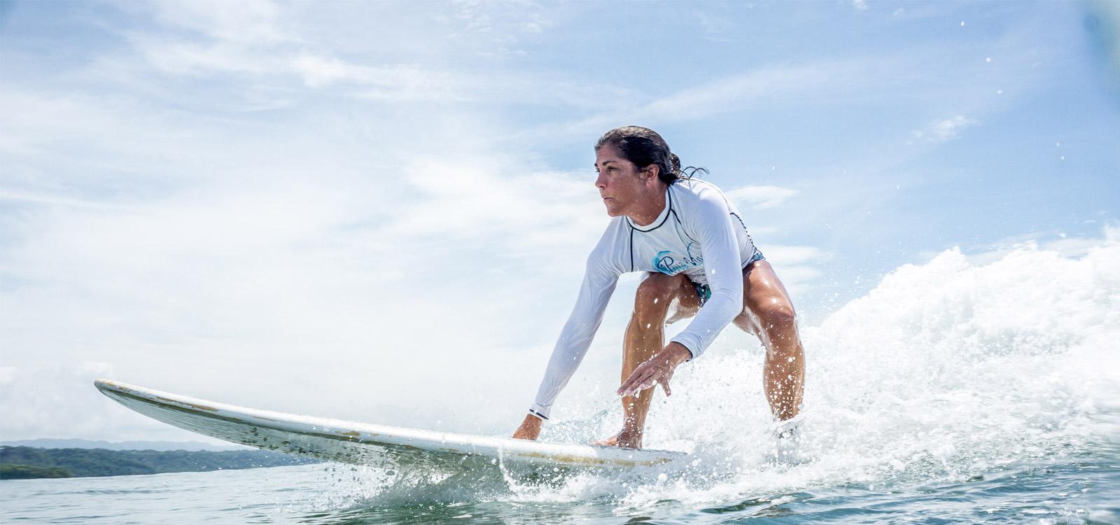 Female surfing during her Women's Surf Camp Costa Rica