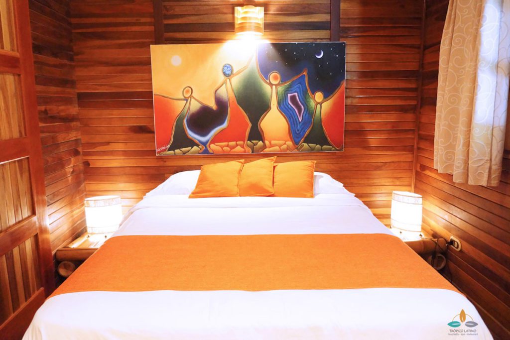 Bedroom with Painting At Surf and Yoga Retreat