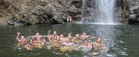 Guests Celebrating in the Waterfalls At Surf Camp Costa Rica