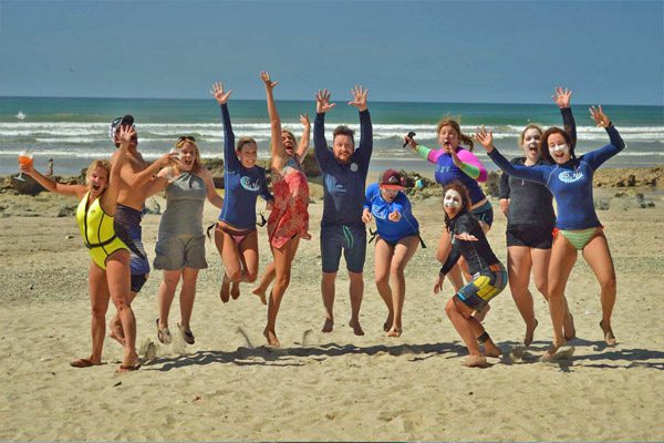 Costa Rica Surf School Participants jumping on beach