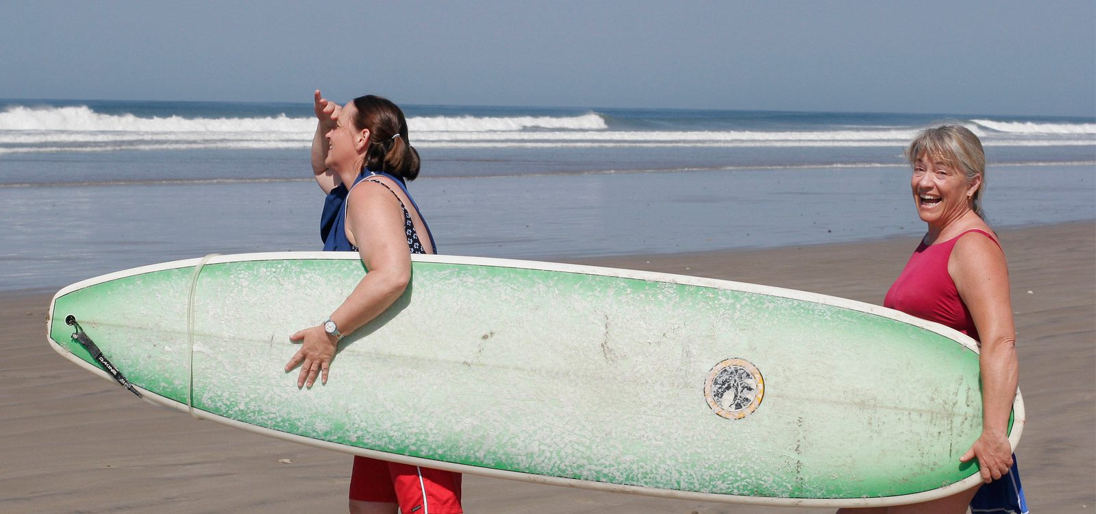 Women Walking with Surfboard At Surf School Costa Rica