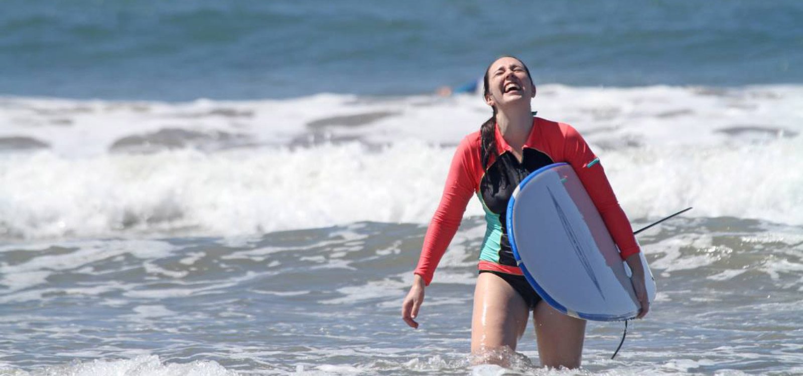 Woman Smiling At Surfing in Costa Rica