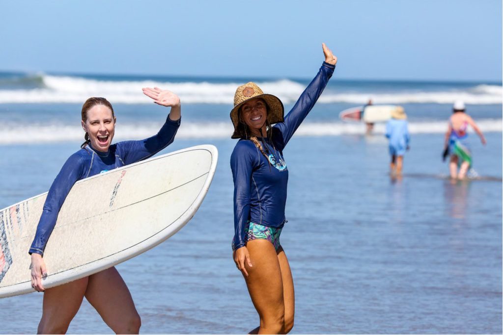 Women Waving at Surf Camp Costa Rica