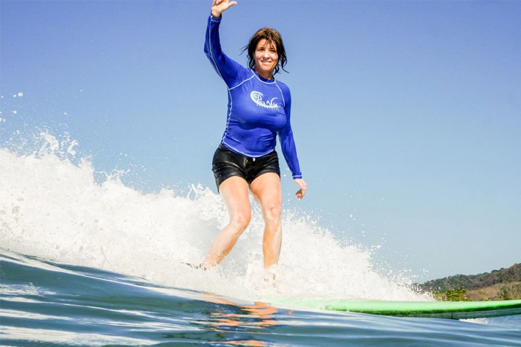 Woman Waving at Surf Camp Costa Rica