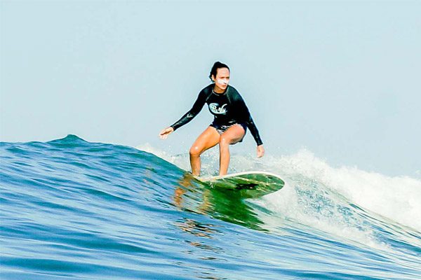 Woman Surfing During Her Costa Rica Beach Vacation