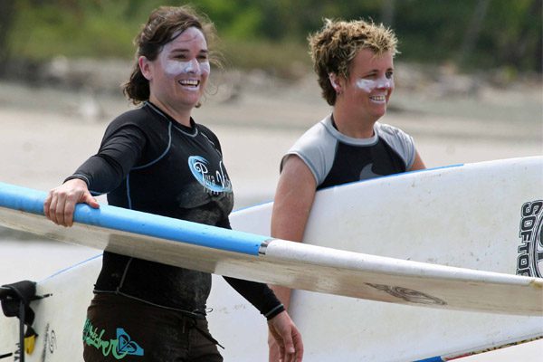 Women With Suncreen Surfing in Costa Rica