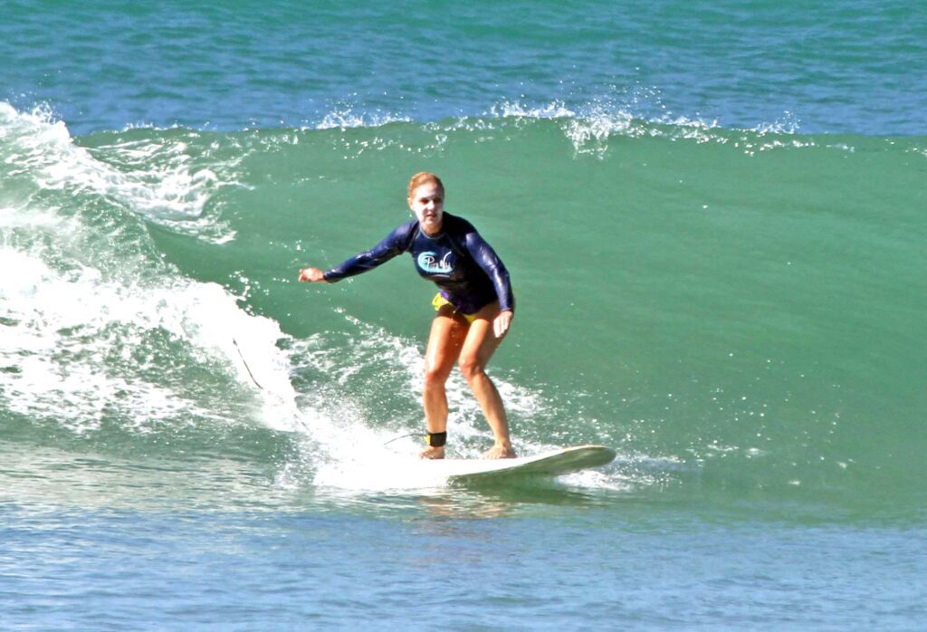 Woman 50+ Surfing in Costa Rica at Pura Vida Adventures surf camp