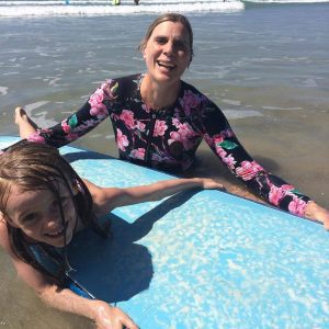 Mother and daughter surfing in Santa Teresa, Costa Rica