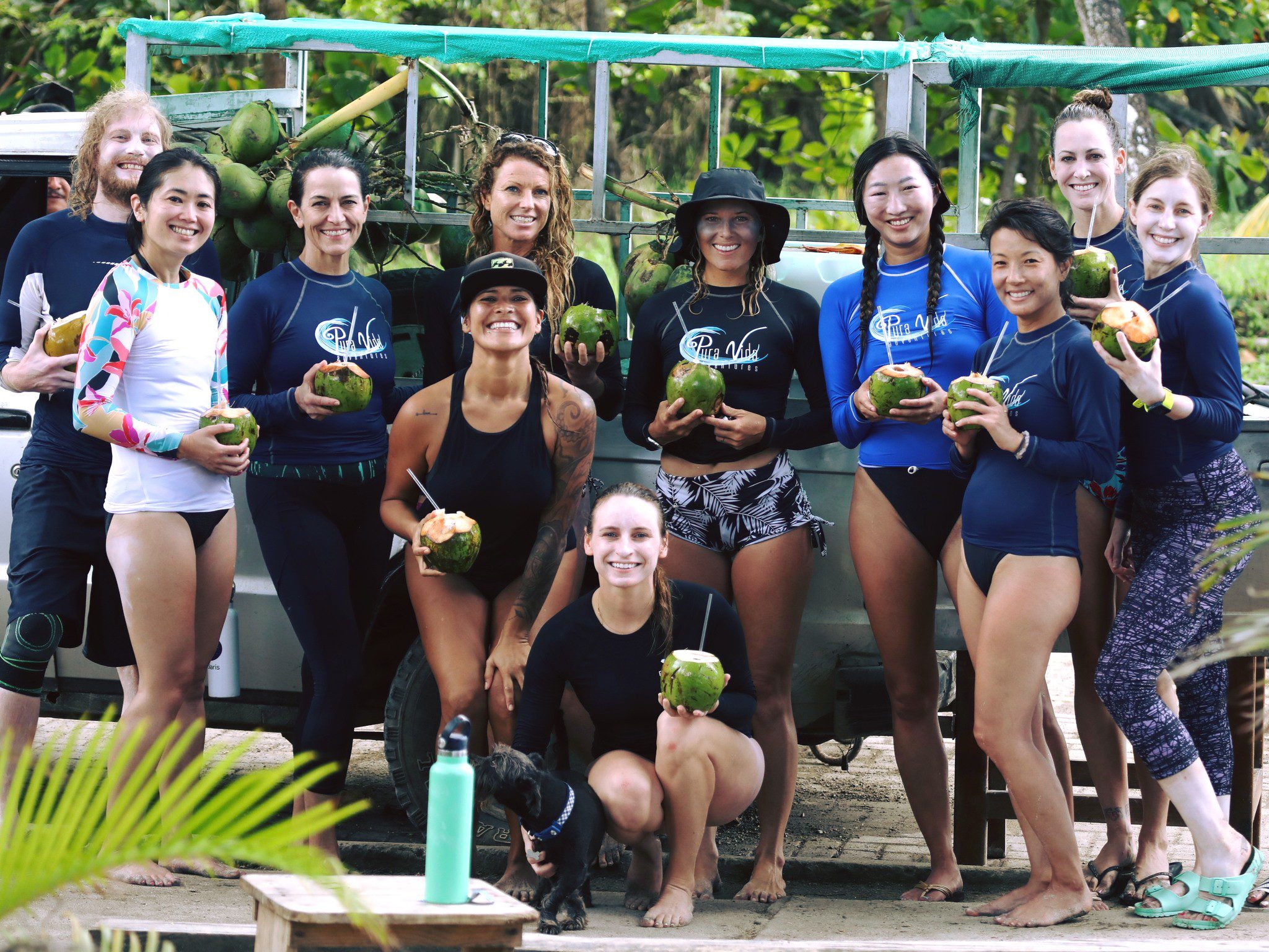 Surf camp guests in Costa Rica taking a break with coconuts water.