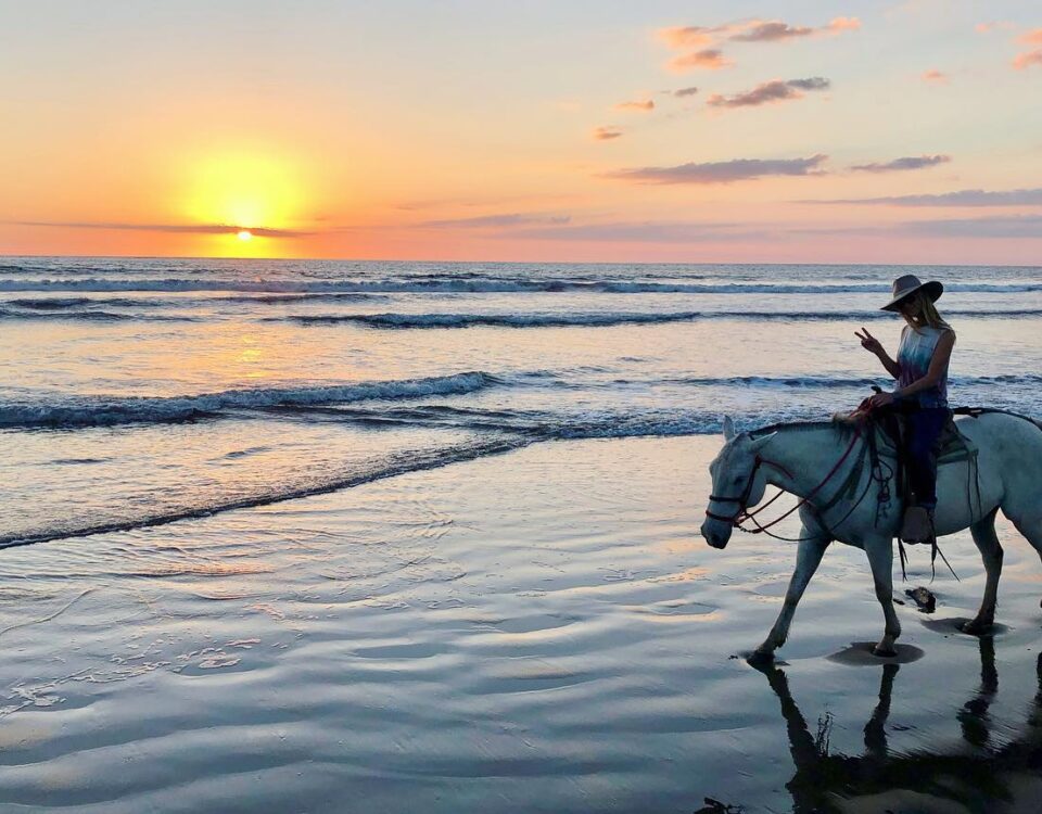 horseback riding at sunset in Santa Teresa, Costa Rica.
