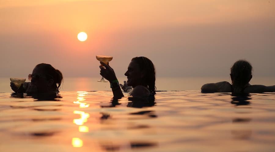 Sunset drinks at infinity pool in Costa Rica.