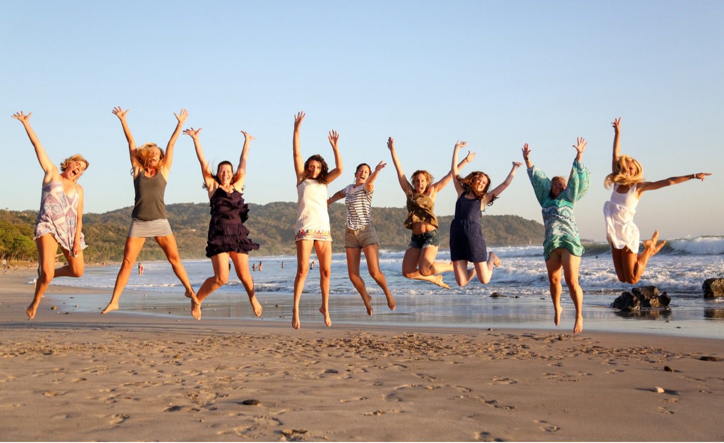 Women celebrating at the beach. Community, sisterhood and connection.