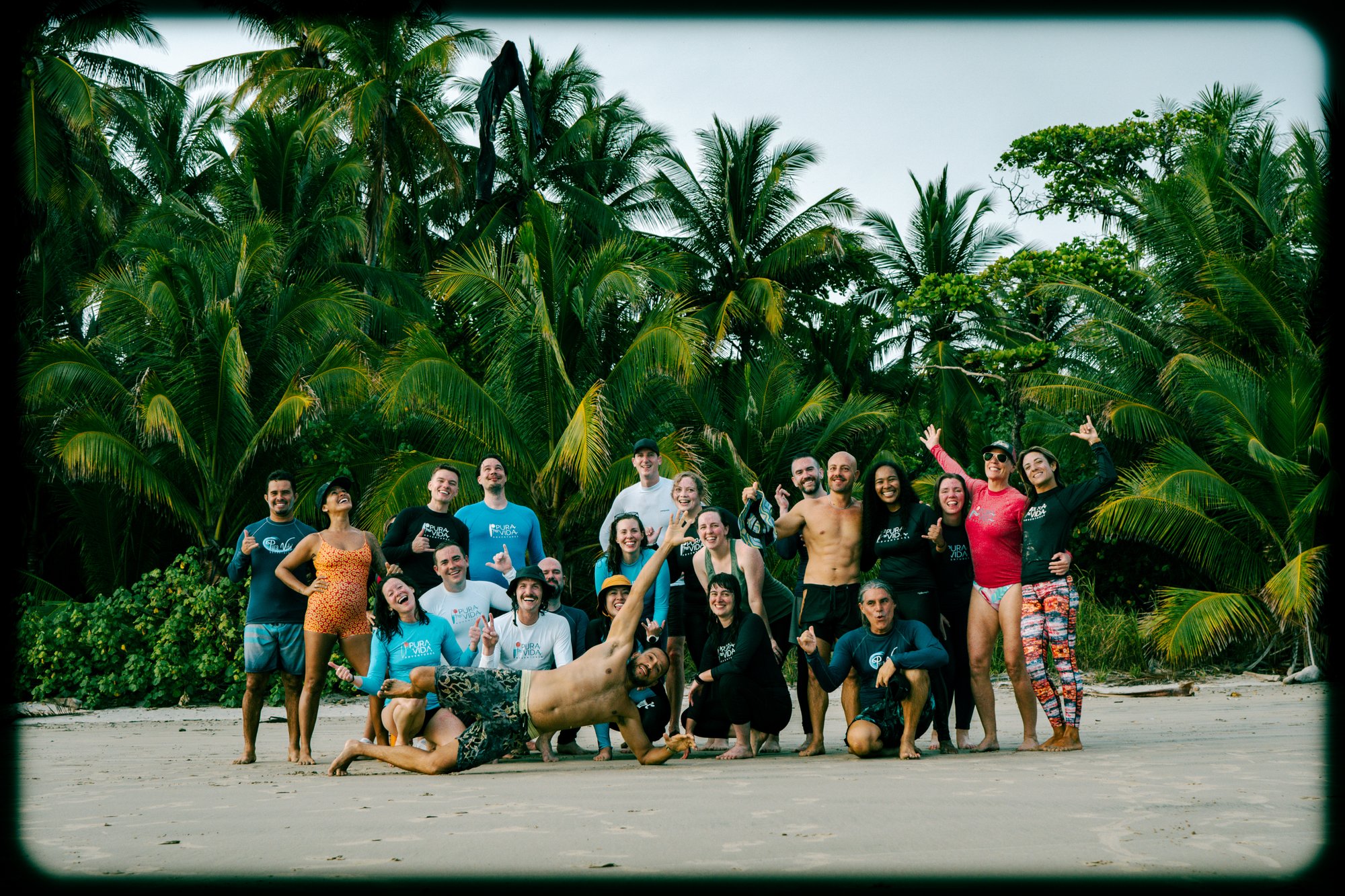 Coed surf retreat group on the beach in Santa Teresa, Costa Rica