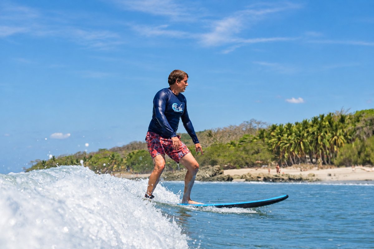 Surfing in front of our retreat at Playa Carmen, Costa Rica.